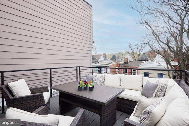 wooden terrace with outdoor lounge area