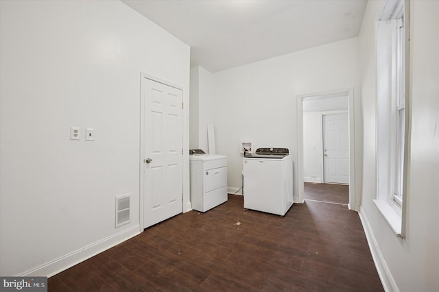 laundry room featuring visible vents, baseboards, washer and clothes dryer, laundry area, and dark wood-style floors