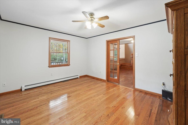 unfurnished bedroom with ornamental molding, light wood-style floors, baseboards, and a baseboard radiator