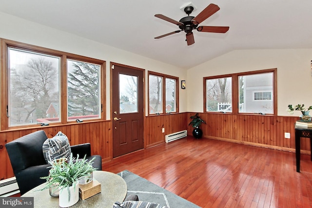 sunroom with baseboard heating, ceiling fan, and vaulted ceiling