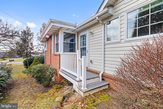 view of property exterior with brick siding