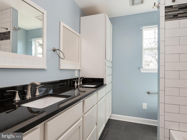 full bathroom with a sink, visible vents, and a wealth of natural light