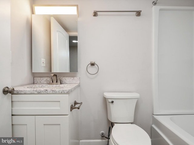 bathroom with toilet and vanity