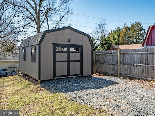 view of shed with fence