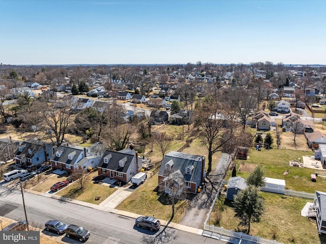 birds eye view of property with a residential view