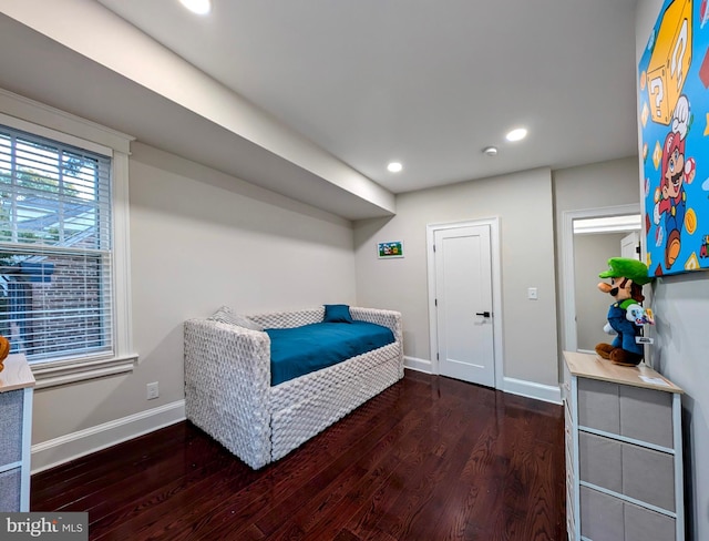 bedroom with recessed lighting, baseboards, and wood finished floors