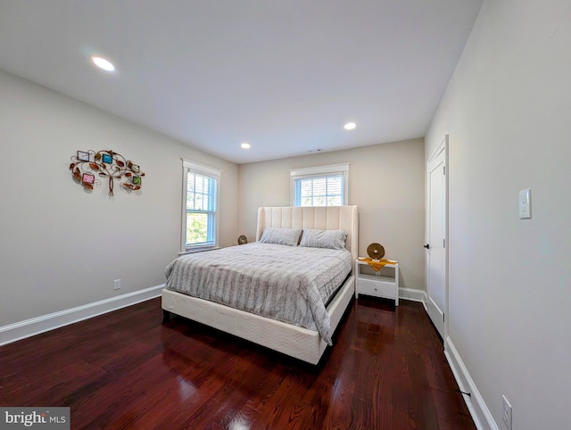 bedroom with recessed lighting, baseboards, and dark wood-style floors