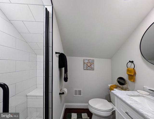 bathroom with vanity, visible vents, lofted ceiling, a shower stall, and toilet