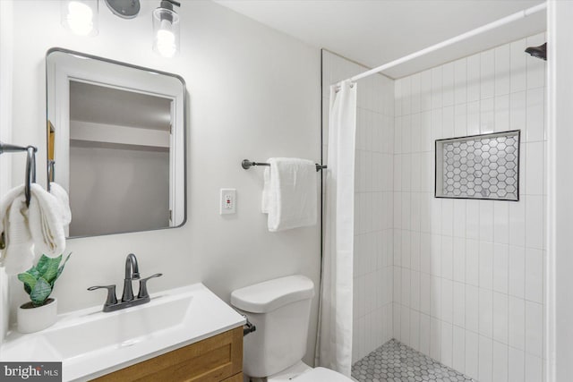 full bath featuring a shower stall, toilet, and vanity