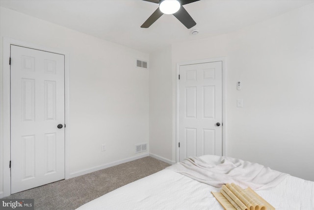 bedroom with ceiling fan, carpet, visible vents, and baseboards