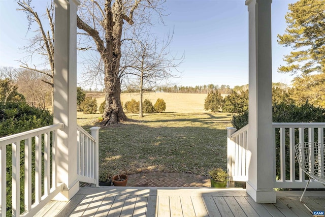 deck with a porch and a lawn