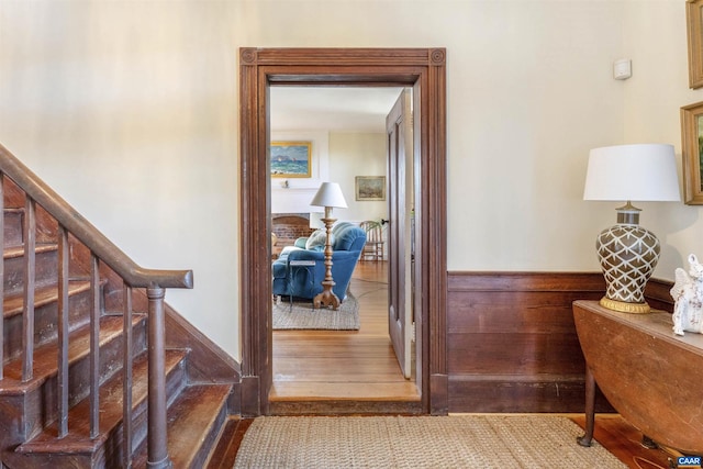 interior space with a wainscoted wall