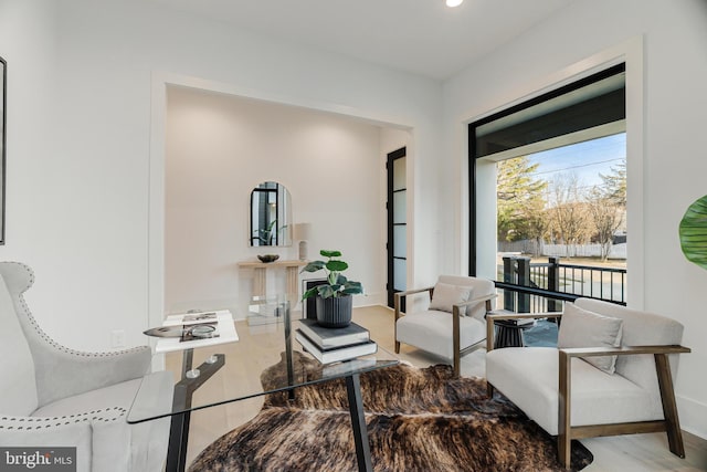 living area featuring baseboards