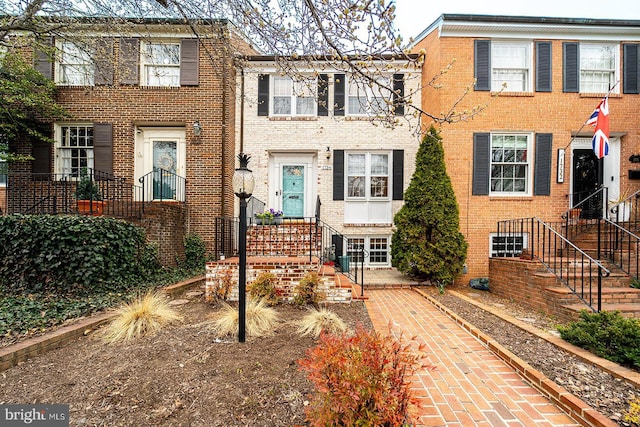 view of front of house with brick siding