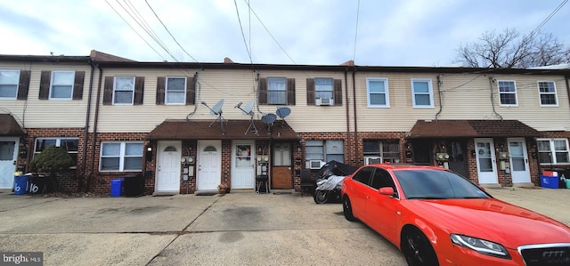 view of property featuring brick siding