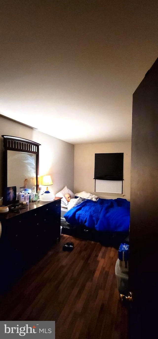 bedroom featuring wood finished floors