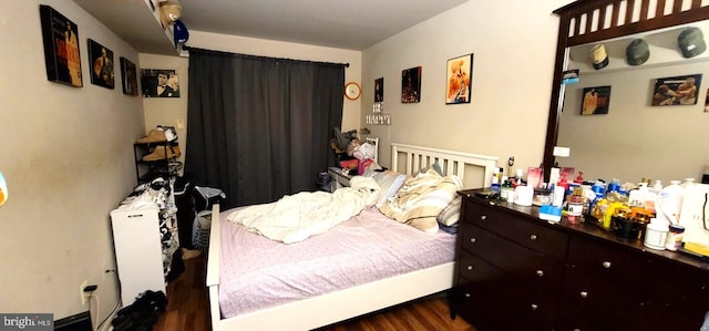 bedroom featuring wood finished floors