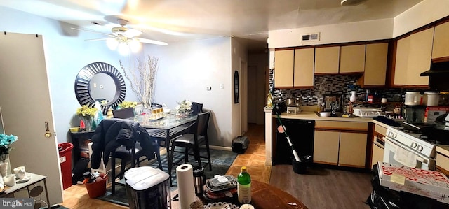 kitchen featuring visible vents, backsplash, cream cabinetry, and light countertops