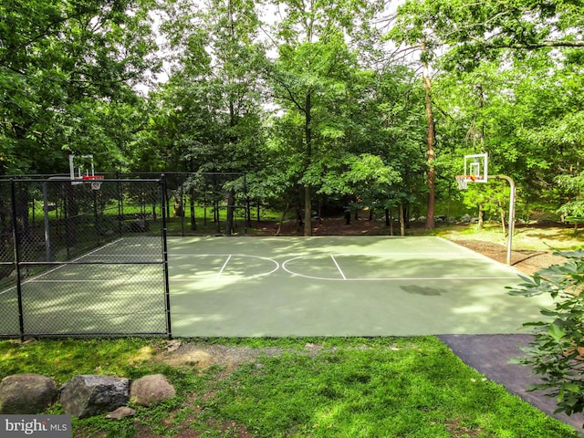 view of sport court featuring community basketball court and fence