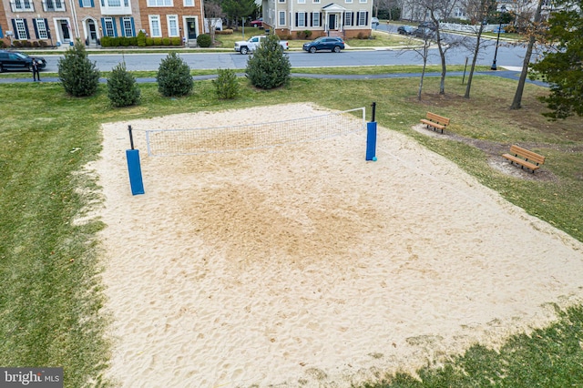 view of home's community featuring volleyball court