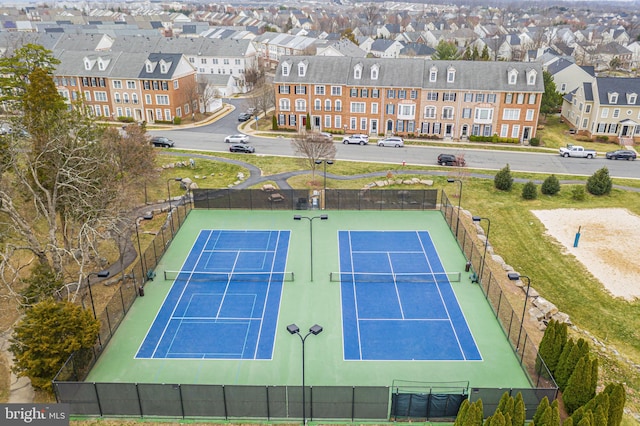 exterior space with fence and a residential view