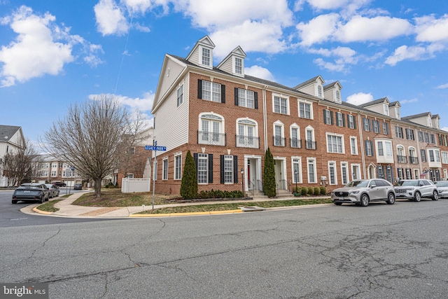 townhome / multi-family property with brick siding