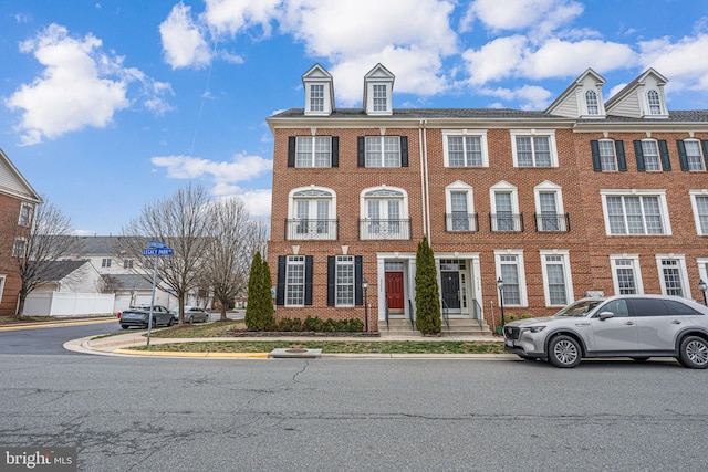 townhome / multi-family property with brick siding