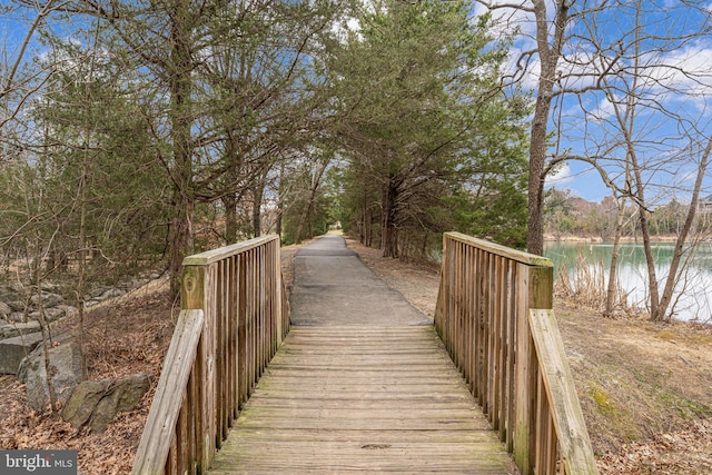 surrounding community featuring a water view