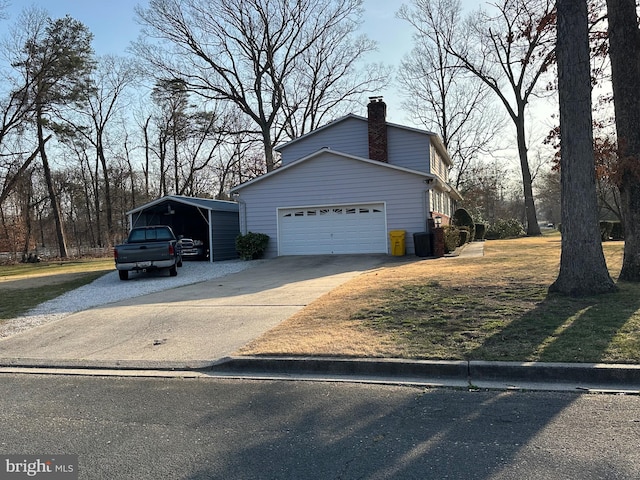 view of property exterior with a lawn, concrete driveway, a garage, a carport, and a chimney