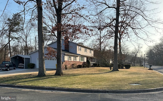 exterior space with a front lawn, an attached garage, a carport, and concrete driveway