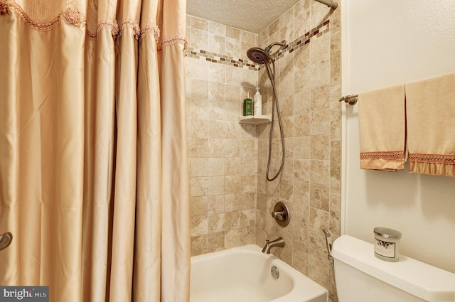 full bathroom featuring toilet, shower / bath combo with shower curtain, and a textured ceiling