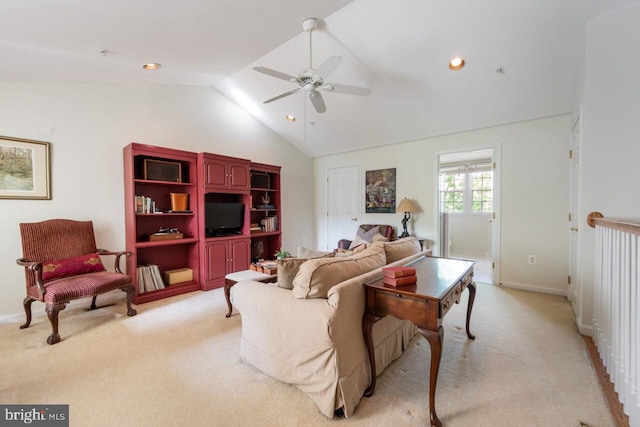 living room with baseboards, ceiling fan, lofted ceiling, and light carpet