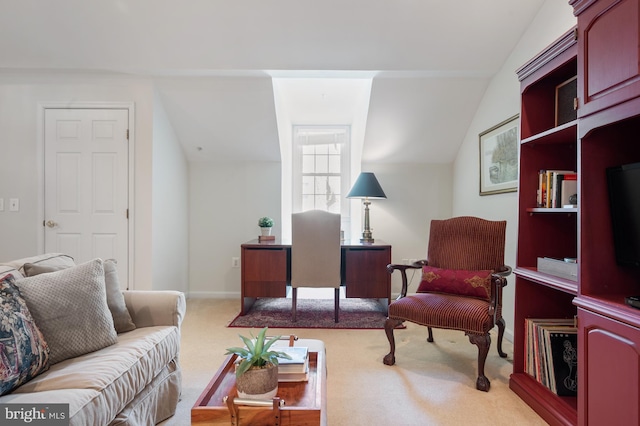 carpeted living area featuring lofted ceiling
