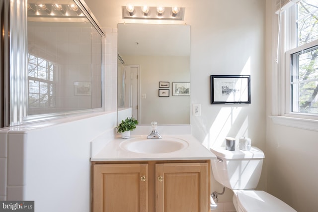 full bath featuring toilet and vanity