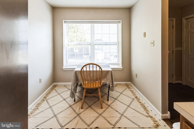 dining space featuring baseboards