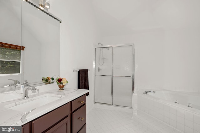 full bath featuring a garden tub, vanity, a shower stall, and tile patterned flooring