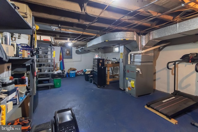 unfinished basement featuring heating unit