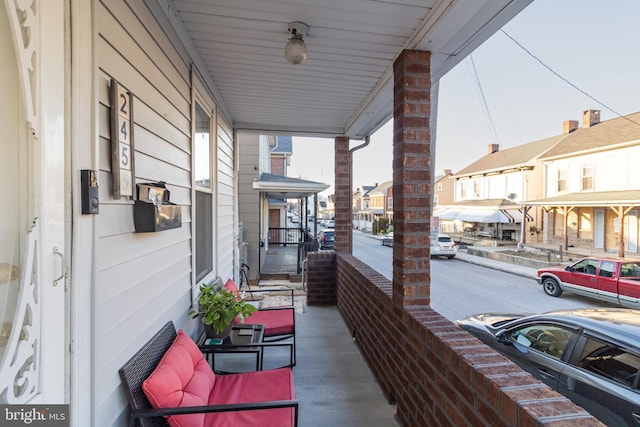 view of patio with a porch and a residential view