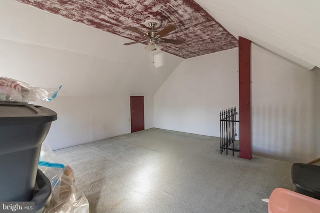 additional living space featuring lofted ceiling and ceiling fan