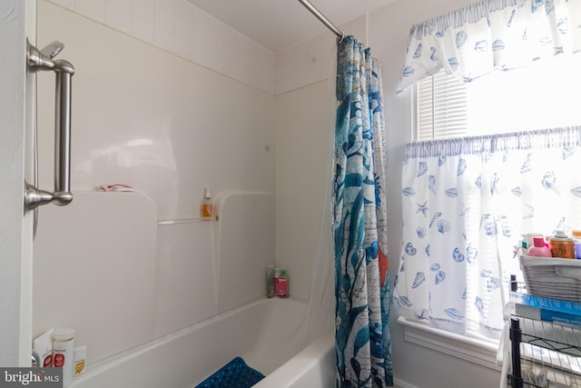 bathroom with shower / tub combo