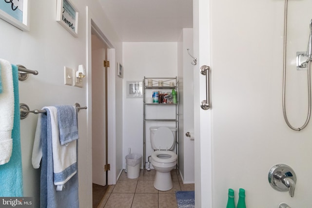 bathroom featuring tile patterned flooring and toilet