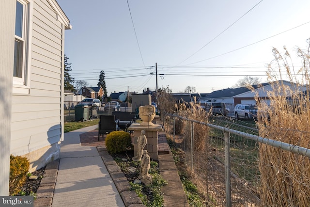 view of yard with a residential view and fence