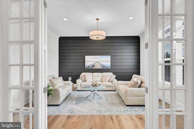 living area with recessed lighting and wood finished floors