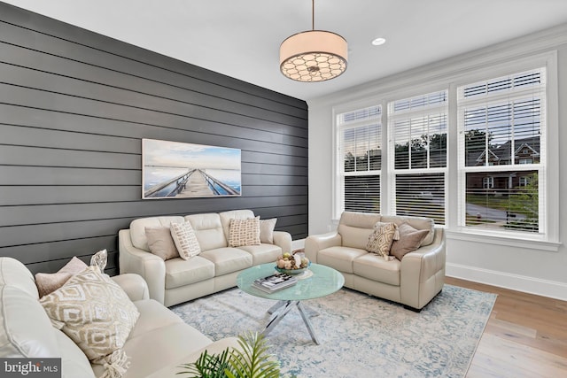 living room with baseboards and wood finished floors