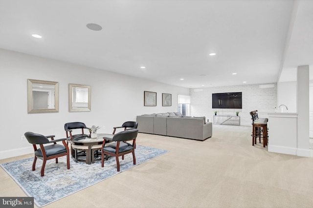 dining room featuring recessed lighting, baseboards, and light carpet