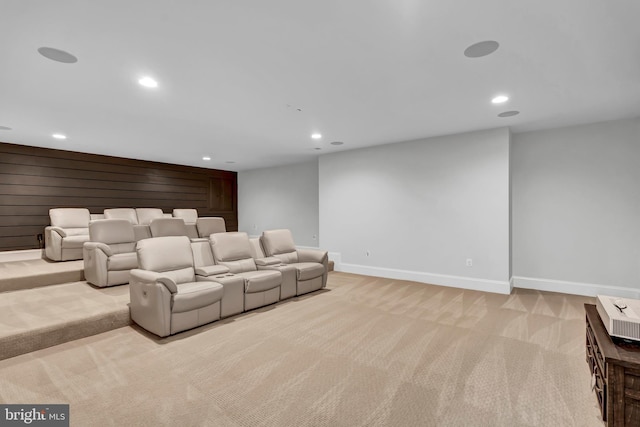 carpeted home theater room with recessed lighting and baseboards