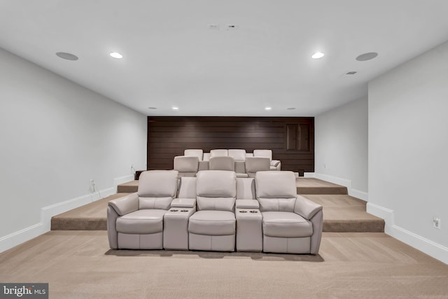 home theater room with light carpet, recessed lighting, and baseboards