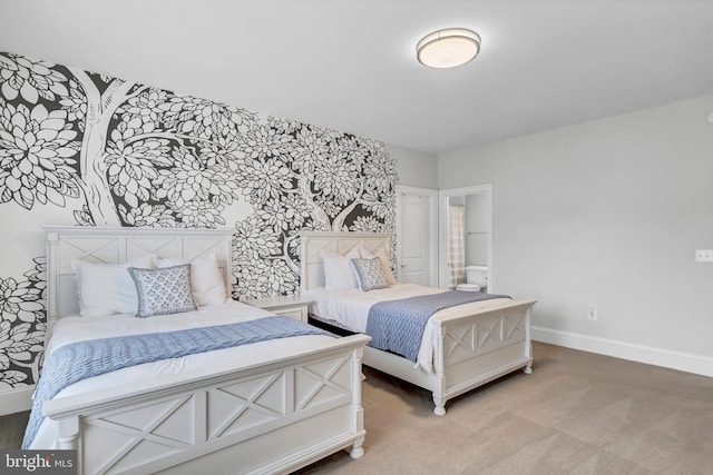 carpeted bedroom featuring baseboards