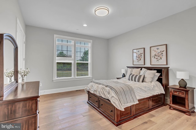 bedroom featuring recessed lighting, baseboards, and light wood-style flooring