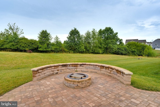 view of patio with an outdoor fire pit